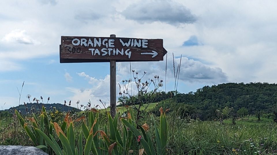 A handmade sign straddling the italyslovenia border copy
